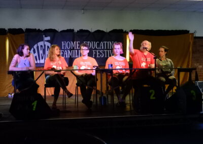 Photo of the HEFF board of directors sat at a table on stage at the festival