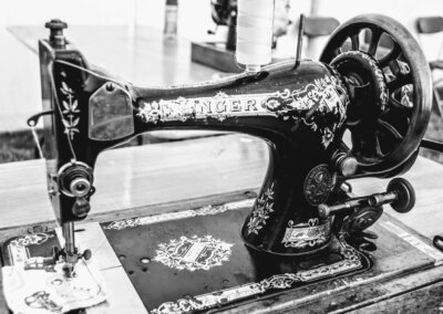 Black and white photo of a vintage Singer sewing machine