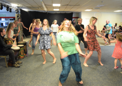 Photo of a group of people learning West African dance